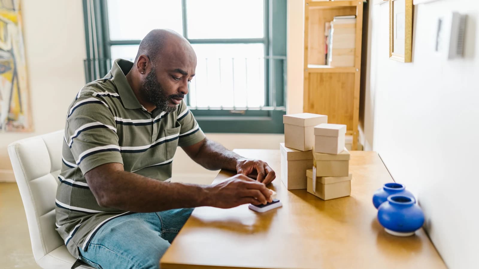 Small-business owner preparing packages at a desk