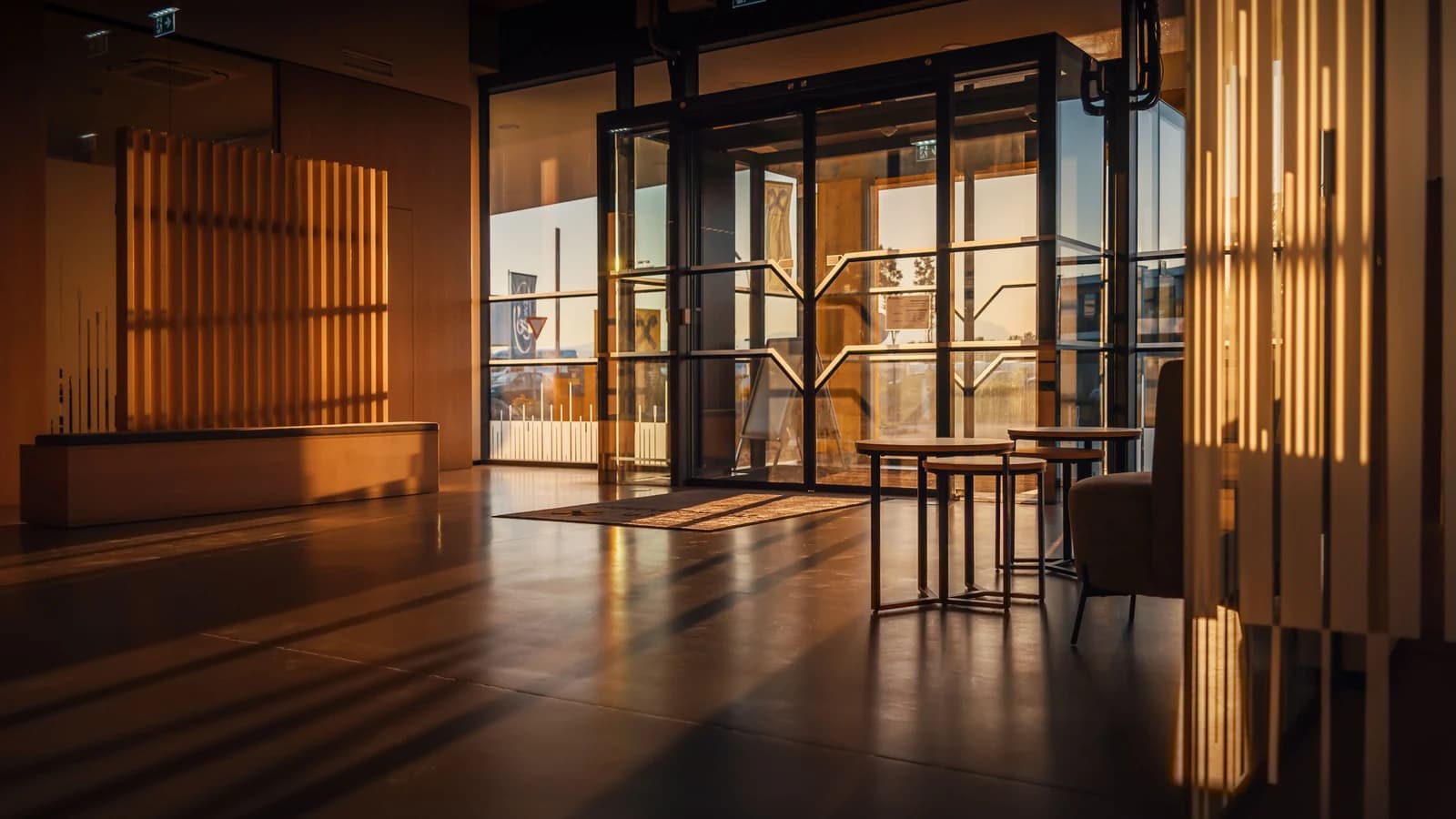 Sunlit hotel lobby with glass doors in Steiermark, Austria