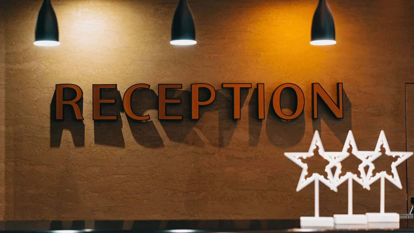 Hotel reception counter with hanging lights